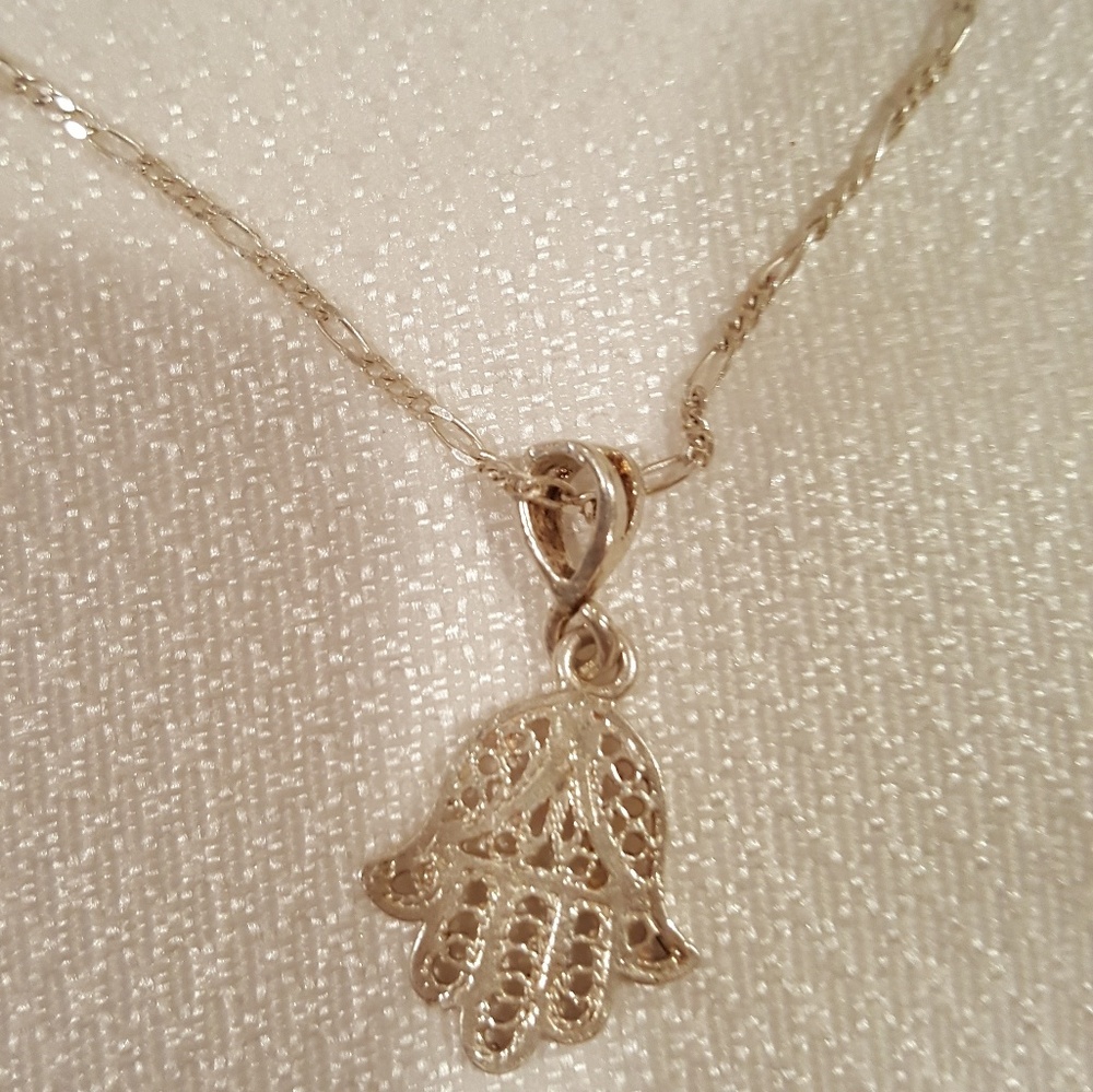 Silver hamsa necklace.